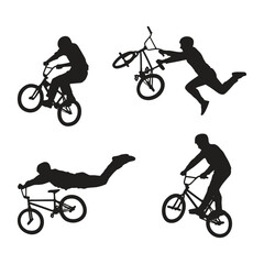 Obraz premium BMX Freestyle Riders Performing Stunts Silhouette