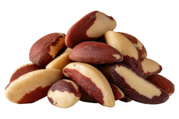 Pile of split brazil nuts, brown and tan, on a dark backdrop
