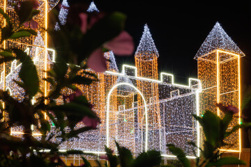 Illuminated castle structure with colorful lights