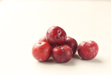 Obraz premium Bunch Of Red Plum Isolated on White Background.
