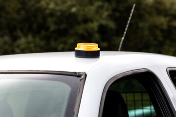V16 emergency beacon light on car roof