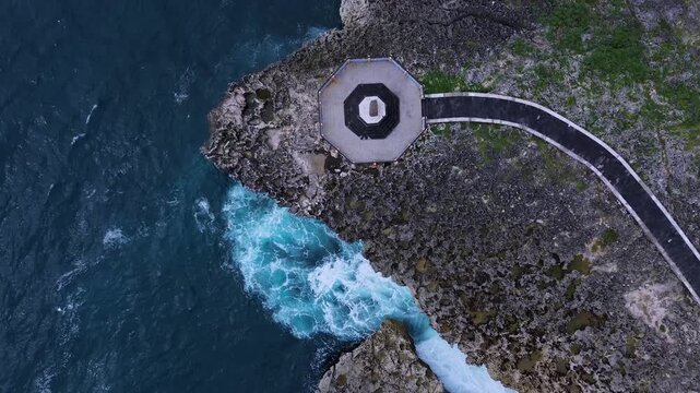 Aerial View Stormwatch Octagonal Deck On Rugged Headland With Pounding Surf, Cinematic Monitoring Scene Evokes,Nusa Dua,Bali