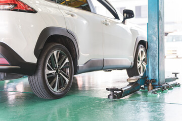 Cars in a car repair shop/pit