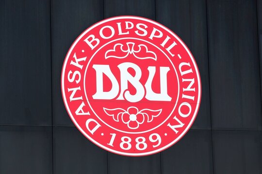 Tilst, Denmark - April 18, 2021: Emblem of the Danish federation and the national football team on a building
