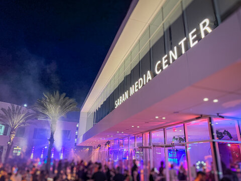 LOS ANGELES, CA, OCT 30, 2025: Saban Media Center building, part of the TV Academy based in North Hollywood, exterior at night with illuminated signage, palm trees, pink and purple lighting