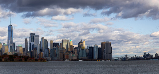 Lower Manhattan skyline across New York Harbor with Freedom Tower, NYC