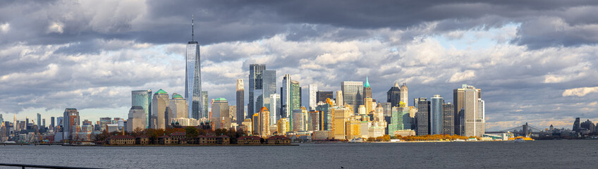 Lower Manhattan skyline across New York Harbor with Freedom Tower, NYC