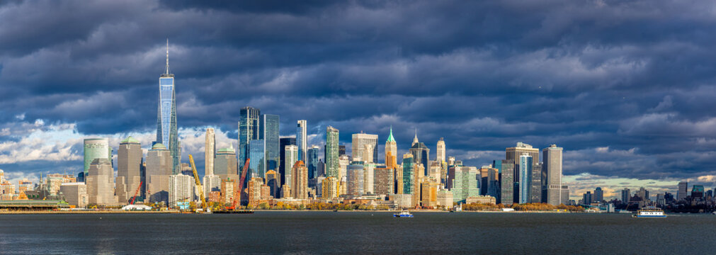 Lower Manhattan skyline across New York Harbor with Freedom Tower, NYC