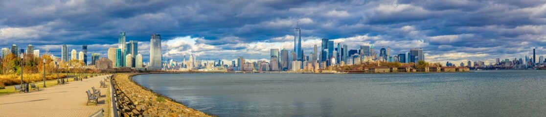 Panoramic view of Lower Manhattan skyline from Jersey City waterfront promenade