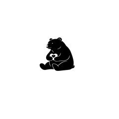 Obraz premium Bear holding a heart