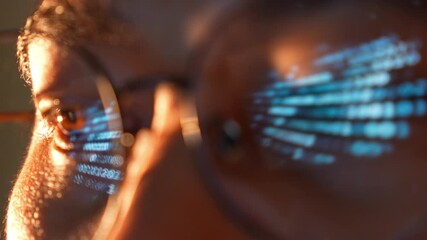 A close-up of a person wearing glasses while using a laptop, with digital binary code reflected in the lenses, symbolizing data analytics, cybersecurity, artificial intelligence, and automation.
- Powered by Adobe