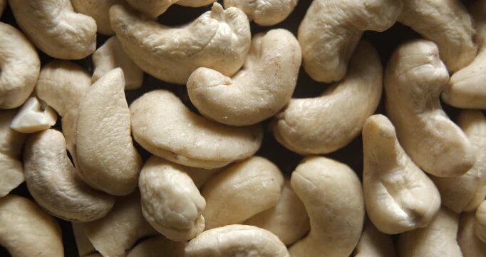 Cashew nuts close up studio shot over rotating