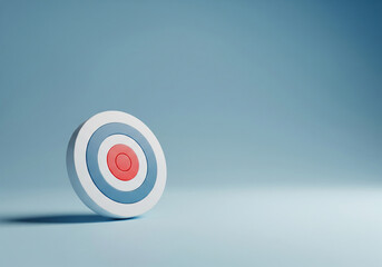 A precisely aligned bullseye target stands as a clear symbol of strategic goals and focused ambition, set against a calming blue backdrop