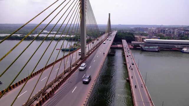Atal Setu bridge with mandovi river bridge and Goa cruise terminal at panaji, old goa, india. day time, push in shot, drone shot, 4k.