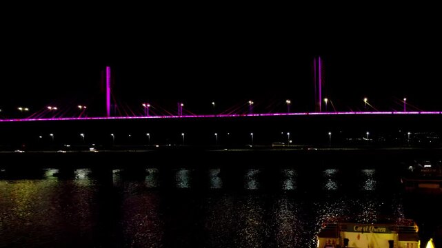 Night view of atal setu bridge with lighting, Mandovi River and cruise at panaji, goa. india. night time, push back shot, drone shot, 4k.