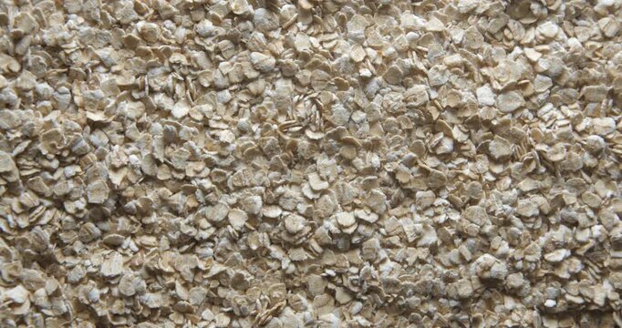Oat flakes close up studio shot over rotating