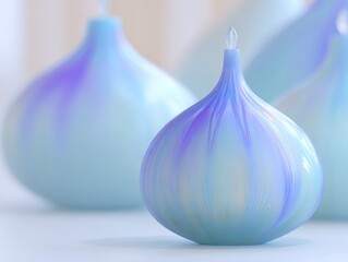 Close up of decorative onion shaped candles in soft pastel colors