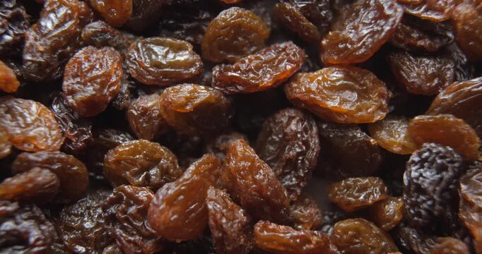 Black raisins close up studio shot over rotating