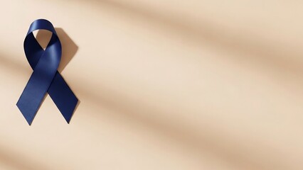 Symbol of hope: a single, deep blue satin ribbon casts a shadow on a light beige background, representing awareness and support for various causes.