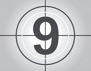 Close-up of a countdown clock with a large number nine displayed. Crosshairs centered. Background is a gradient gray
