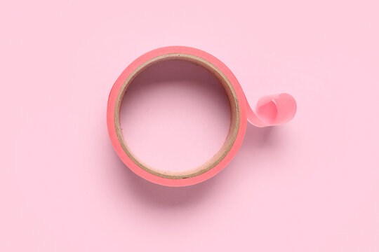Masking tape roll on pink background