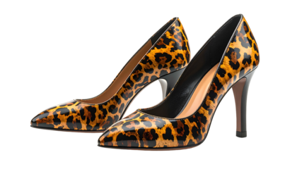 Pair of glossy, pointed-toe high heels in a leopard print pattern, isolated on black