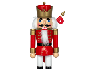 A festive wooden soldier figurine with a red uniform and gold accents, against black