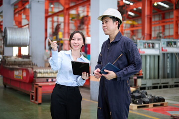 Engineers or technicians talking about work in the factory