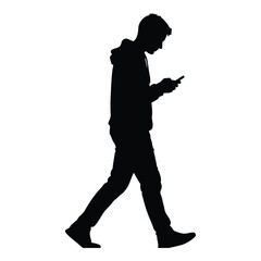Silhouette of a young man wearing a hooded sweatshirt walking while intently looking down at his mobile smartphone on white background