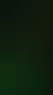 Vertical video. Lens glow. Soft light overlay. Defocused color old cinematic reflection effect. Night beam green flare abstract black background.