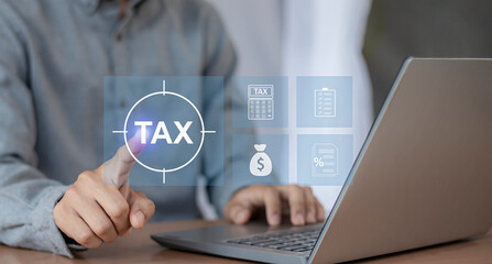 Tax return calculation concept financial research government tax businessman using laptop filling out income tax form online for payment