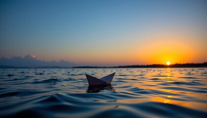 Serene Sunset with Origami Boat Floating Calm Water