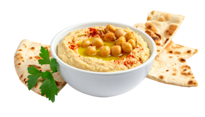 Creamy hummus in white bowl, chickpeas, paprika, olive oil, with pita bread and parsley