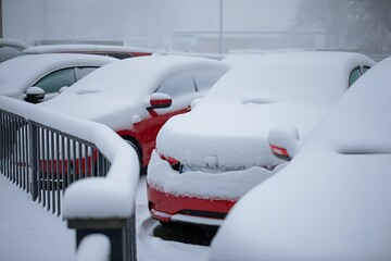 The car is covered with snow.