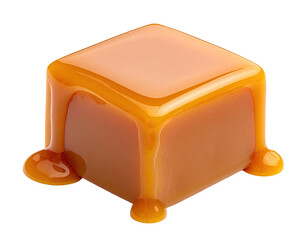 Isolated cube of golden, dripping confection on a black background