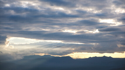 Landscape image of mountain views and cloudy sunset sky