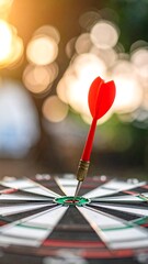 Close-up of dart in the center of the dartboard, with blurry background