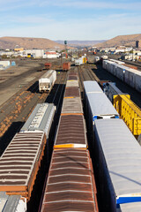 Aerial view or many container trains at Rail road logistics hub in Yakima city, Washington state.