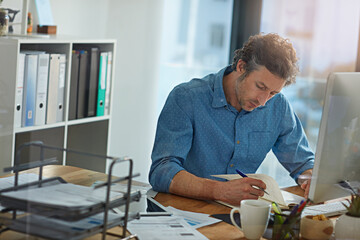 Computer, notebook and research with business man in office for account manager, planning and...