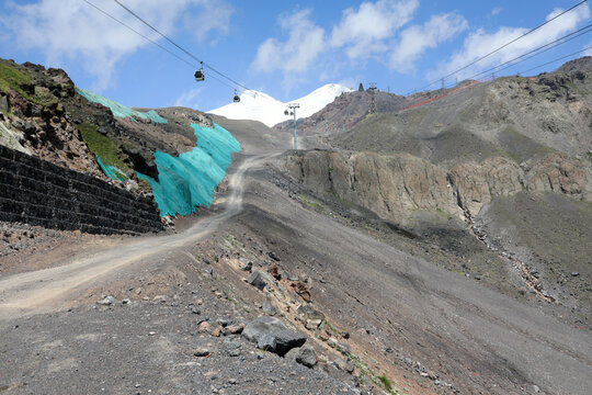 Cable car on mount Elbrus with snowy peaks in  background