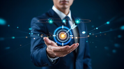 Businessman presenting futuristic target concept with glowing blue graphics