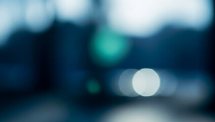 Abstract blue and teal background with soft light bokeh circles creating a calm modern atmosphere, smooth gradients, gentle glow, and elegant abstract visual texture.