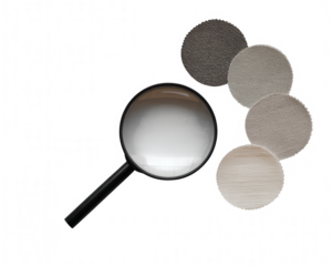 Magnifying glass examining circular filter discs on transparent background black background