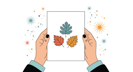 A pair of hands holds up a piece of paper displaying three colorful autumn leaves, surrounded by decorative, festive sparkles.