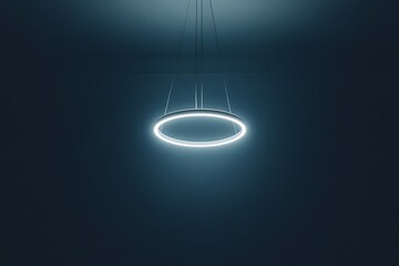 Circular pendant lamp hanging from fine wires with gentle illumination