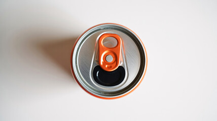 Close-up of an orange soda can with pull tab