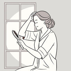 Woman brushing her hair while sitting by the window in a robe  