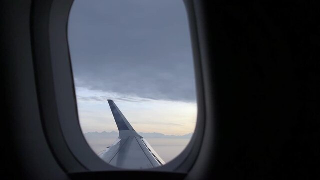 Indian airlines night and day flight from Delhi airport to Srinagar Kashmir destination featuring Airbus cabin window views cloudy skies and travel atmosphere journey, but air pollution in 4k footage.