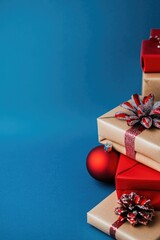 Stacked gifts in red, brown and blue background