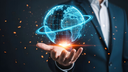 Businessman holding a glowing blue digital earth globe with rings.